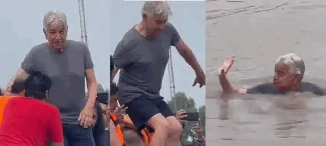 WATCH: Khawaja Asif jumps into a canal to cool off in the sweltering heat.