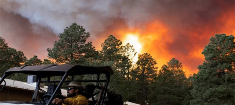 One Fatality Reported In New Mexico Village Due To Wildfire, Displacing Thousands