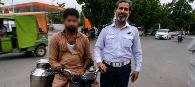 Lahore Milkman Caught With Rs100,000 in Unpaid E-Challans After 50 Helmet Violations